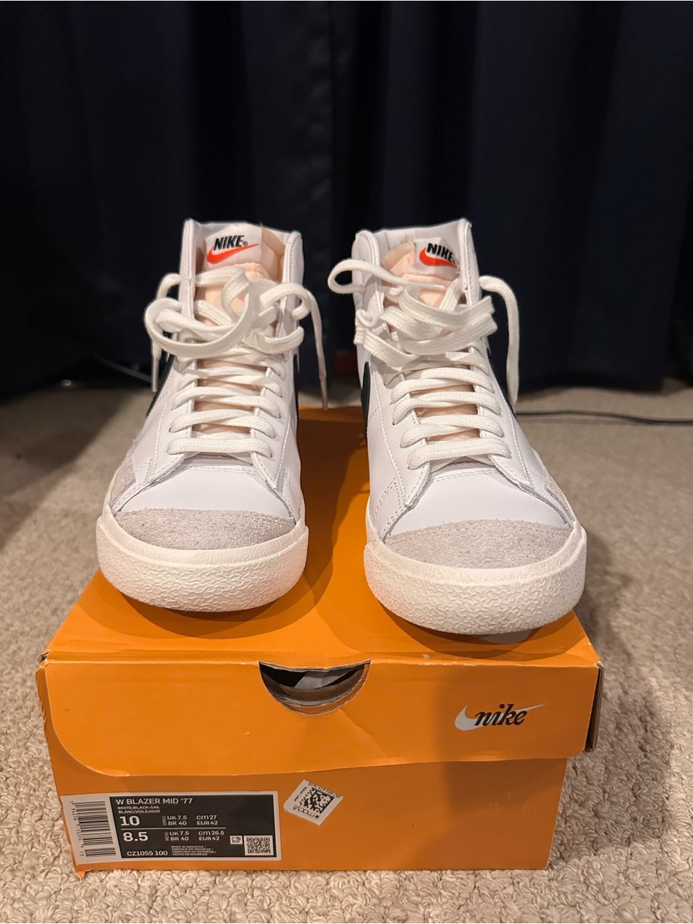 Nike White High-Top Sneakers with Orange Tongue Logo